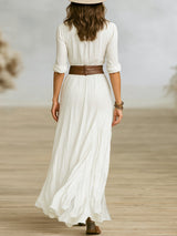 Robe longue ceinturée à revers plissés