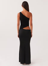 Dos nu robe noire longue asymétrique, silhouette chic